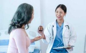 Doctor prescribing hormone therapy to patient in Texas